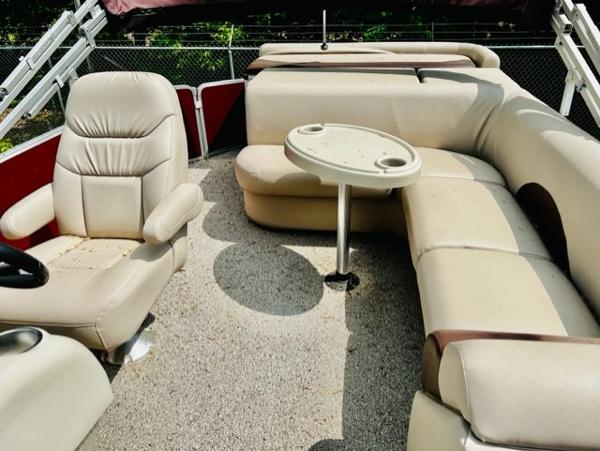 Slide: The Image of 2016 Weeres Pontoons ECLIPSE 240TT interior with beige seating and table. - 5