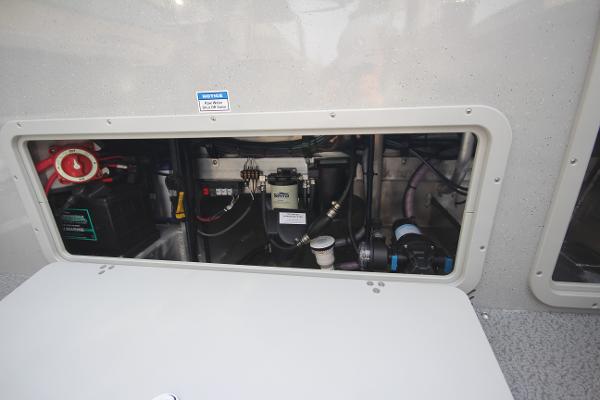 Slide: The Image of Engine compartment of 2023 Weldcraft 210 Revolution F200XB boat, showcasing internal components. - 10
