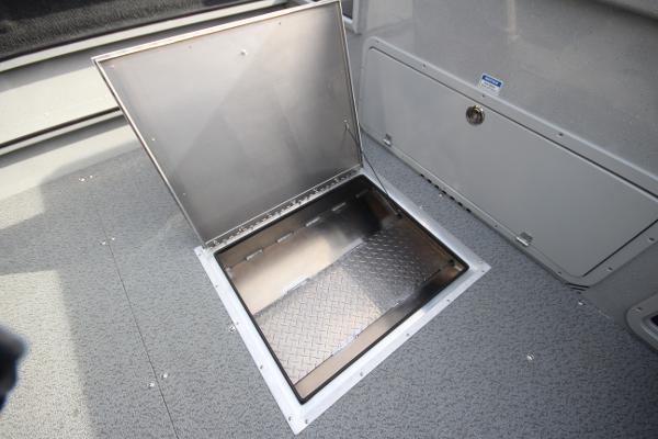 Slide: The Image of 2023 Weldcraft 210 Revolution F200XB in-stock storage compartment. - 11