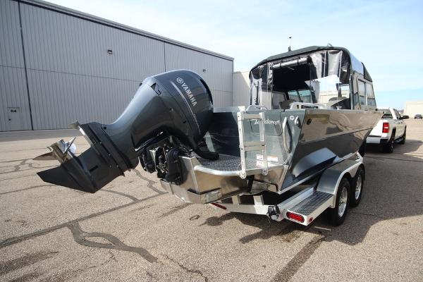 Slide: The Image of 2023 Weldcraft 210 Revolution F200XB boat with Yamaha outboard motor on trailer. - 18