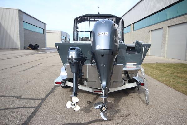 Slide: The Image of 2023 Weldcraft 210 Revolution F200XB boat, rear view with dual outboard motors. - 32