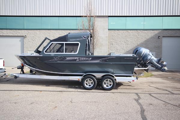 Slide: The Image of 2023 Weldcraft 210 Revolution F200XB boat on trailer, side view. - 35