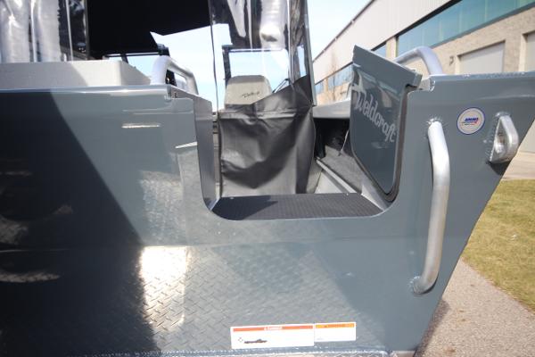Slide: The Image of 2023 Weldcraft 210 Revolution F200XB boat entryway with open door. - 7