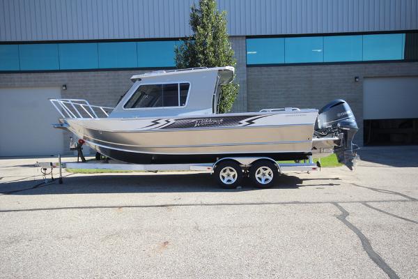 Slide: The Image of 2026 Weldcraft 220 Ocean King 250XB boat on trailer, parked outdoors. - 1