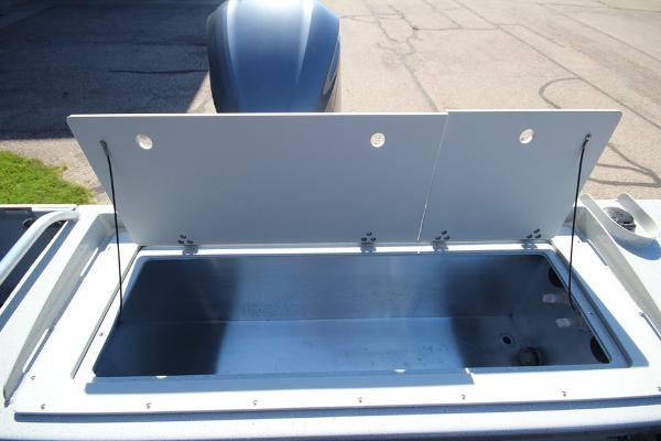 Slide: The Image of Open storage compartment on 2026 Weldcraft 220 Ocean King 250XB boat. - 11
