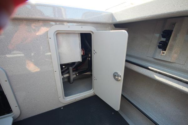 Slide: The Image of 2026 Weldcraft 220 Ocean King 250XB boat compartment with open access panel. - 13