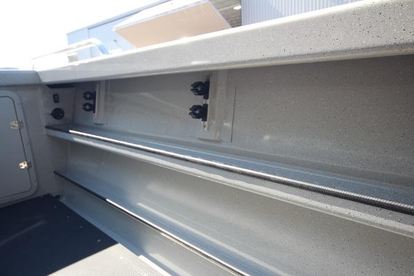 Slide: The Image of Interior view of 2026 Weldcraft 220 Ocean King 250XB boat, showcasing storage compartments. - 14