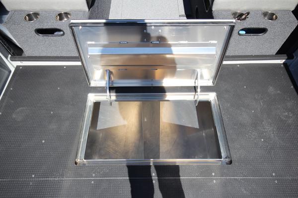 Slide: The Image of Open storage compartment on 2026 Weldcraft 220 Ocean King 250XB boat deck. - 16