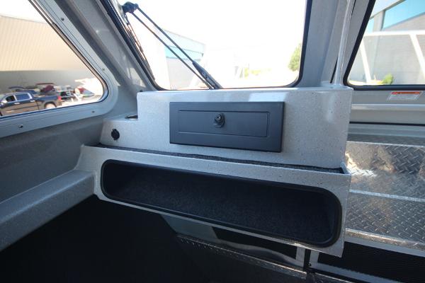 Slide: The Image of Interior of 2026 Weldcraft 220 Ocean King 250XB boat, featuring storage compartments. - 22