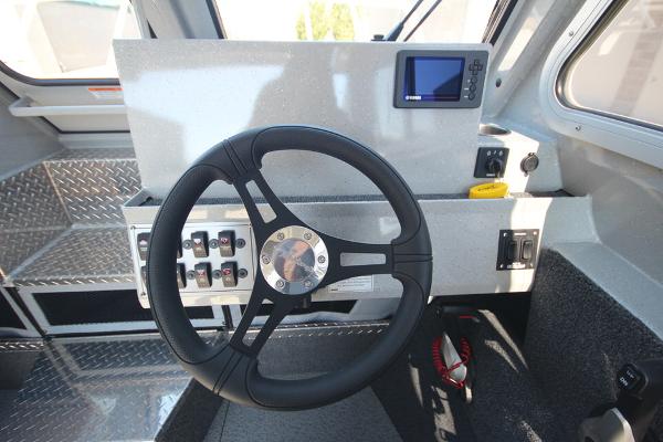 Slide: The Image of Steering wheel and dashboard of 2026 Weldcraft 220 Ocean King 250XB boat. - 24
