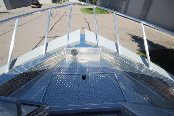 Slide: The Image of 2026 Weldcraft 220 Ocean King 250XB boat deck with diamond plate flooring and railing. - 28