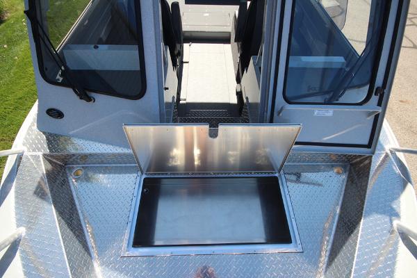 Slide: The Image of 2026 Weldcraft 220 Ocean King 250XB boat with open storage compartment and dual cabin doors. - 29