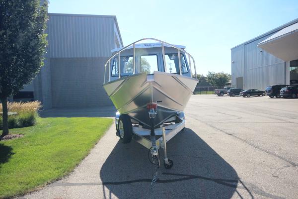 Slide: The Image of 2026 Weldcraft 220 Ocean King 250XB boat on trailer, parked outdoors near industrial buildings. - 3