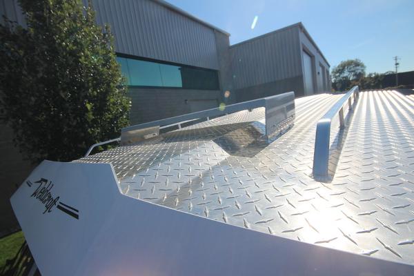 Slide: The Image of 2026 Weldcraft 220 Ocean King 250XB boat with diamond plate deck in sunlight. - 31