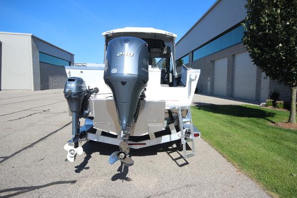 Slide: The Image of 2026 Weldcraft 220 Ocean King 250XB boat with dual outboard motors, parked outdoors. - 6