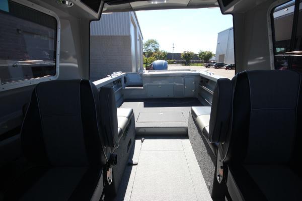 Slide: The Image of Interior of 2026 Weldcraft 220 Ocean King 250XB boat, featuring spacious seating and modern design. - 9