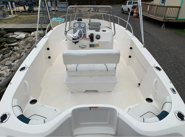 Slide: The Image of 2017 Wellcraft 180 Fisherman boat interior with seating and steering console. - 2