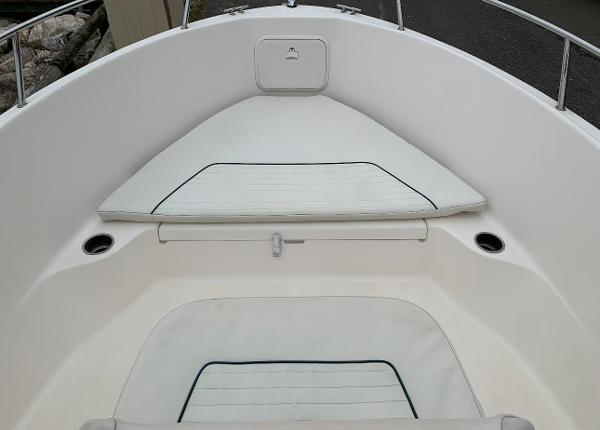 Slide: The Image of 2017 Wellcraft 180 Fisherman boat interior with white cushioned seating. - 3