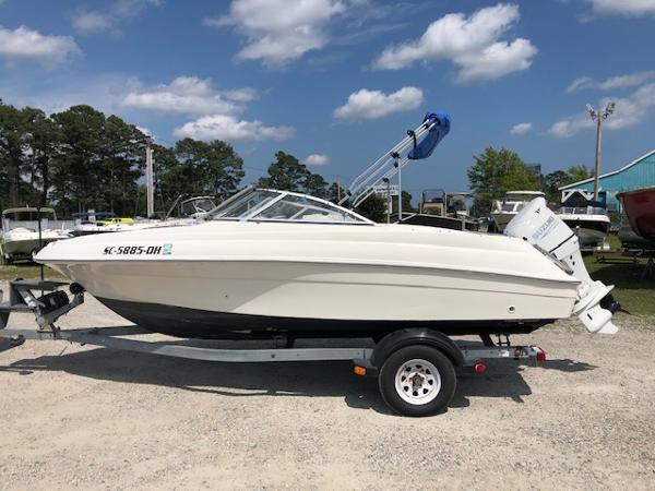 Slide: The Image of 2001 Wellcraft 180 Sportsman boat on trailer under blue sky. - 0
