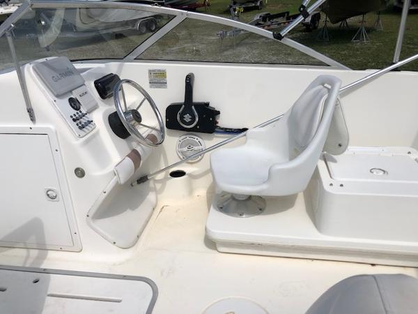 Slide: The Image of 2001 Wellcraft 180 Sportsman boat interior with steering wheel and seating. - 11