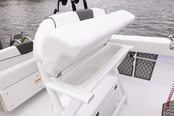Slide: The Image of 2024 Wellcraft 222 Fisherman boat with open storage compartment. - 30