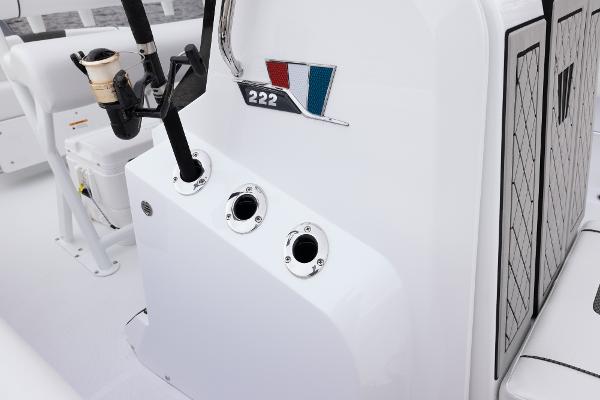 Slide: The Image of 2024 Wellcraft 222 Fisherman boat console with rod holders and logo. - 36