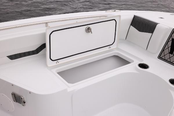 Slide: The Image of 2024 Wellcraft 222 Fisherman boat storage compartment and seating area. - 37