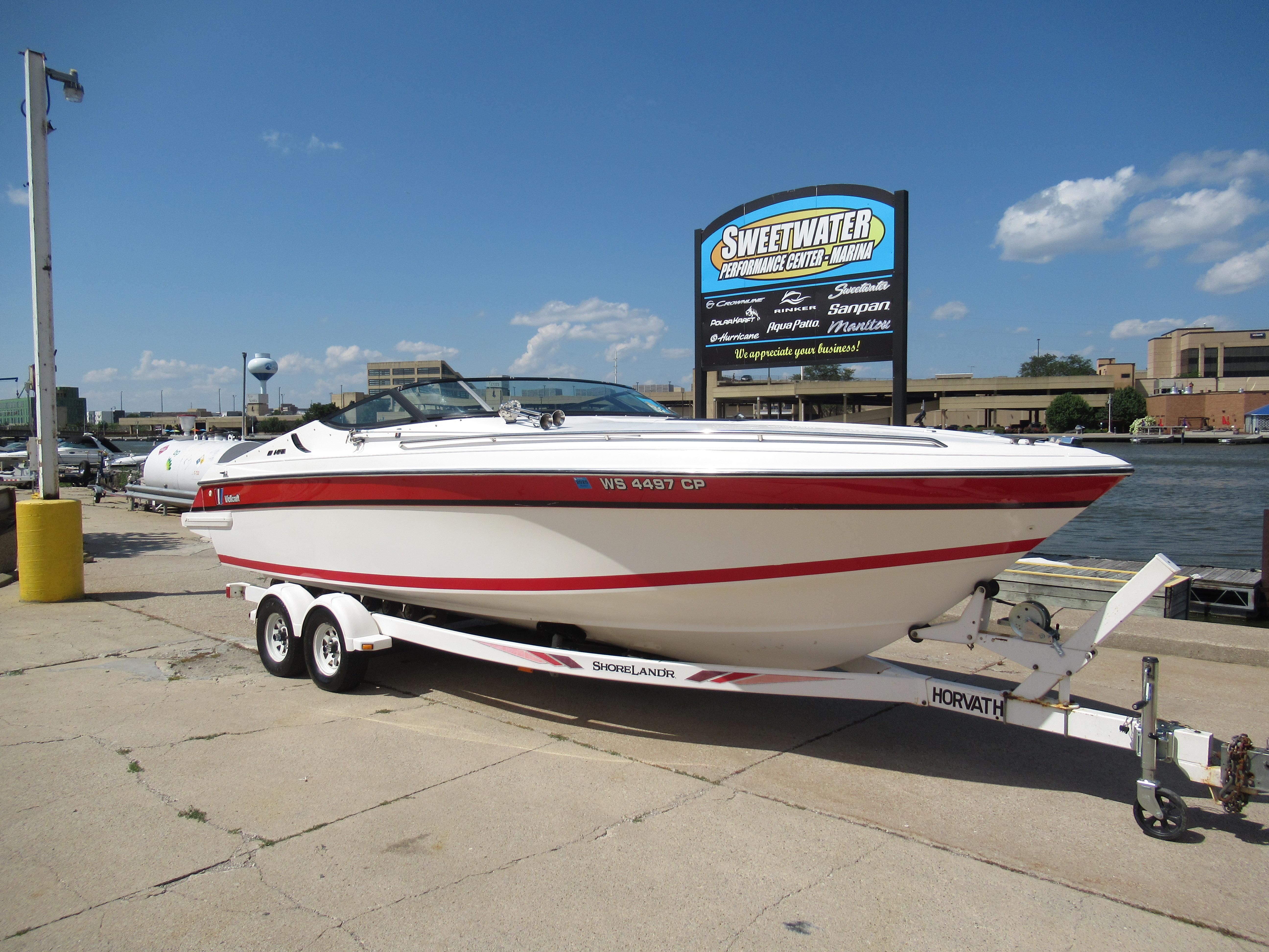 Slide: The Image of 1990 Wellcraft 23 NOVA boat on trailer at Sweetwater Performance Center Marina. - 1