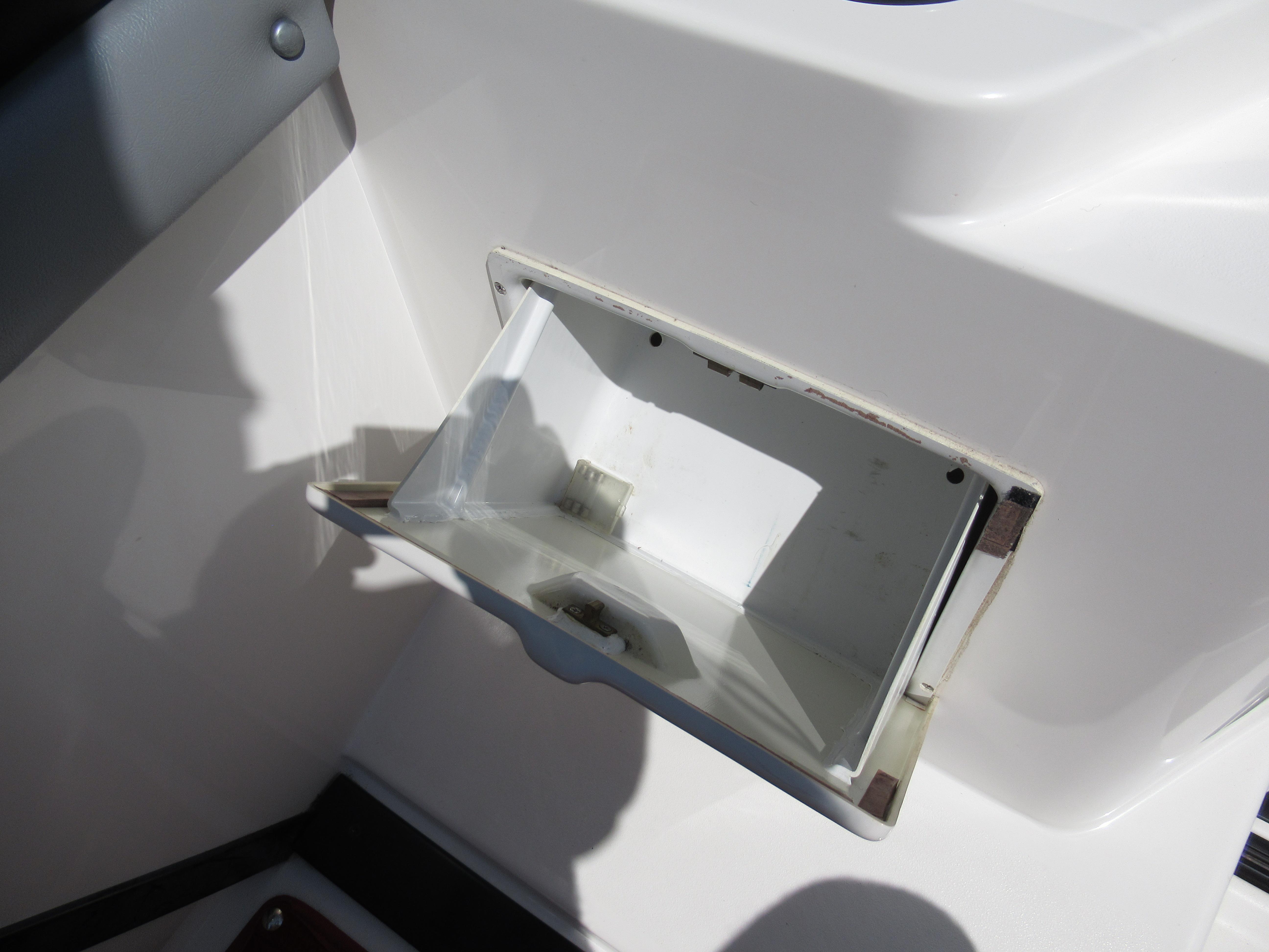 Slide: The Image of Open storage compartment on a 1990 Wellcraft 23 NOVA boat. - 10