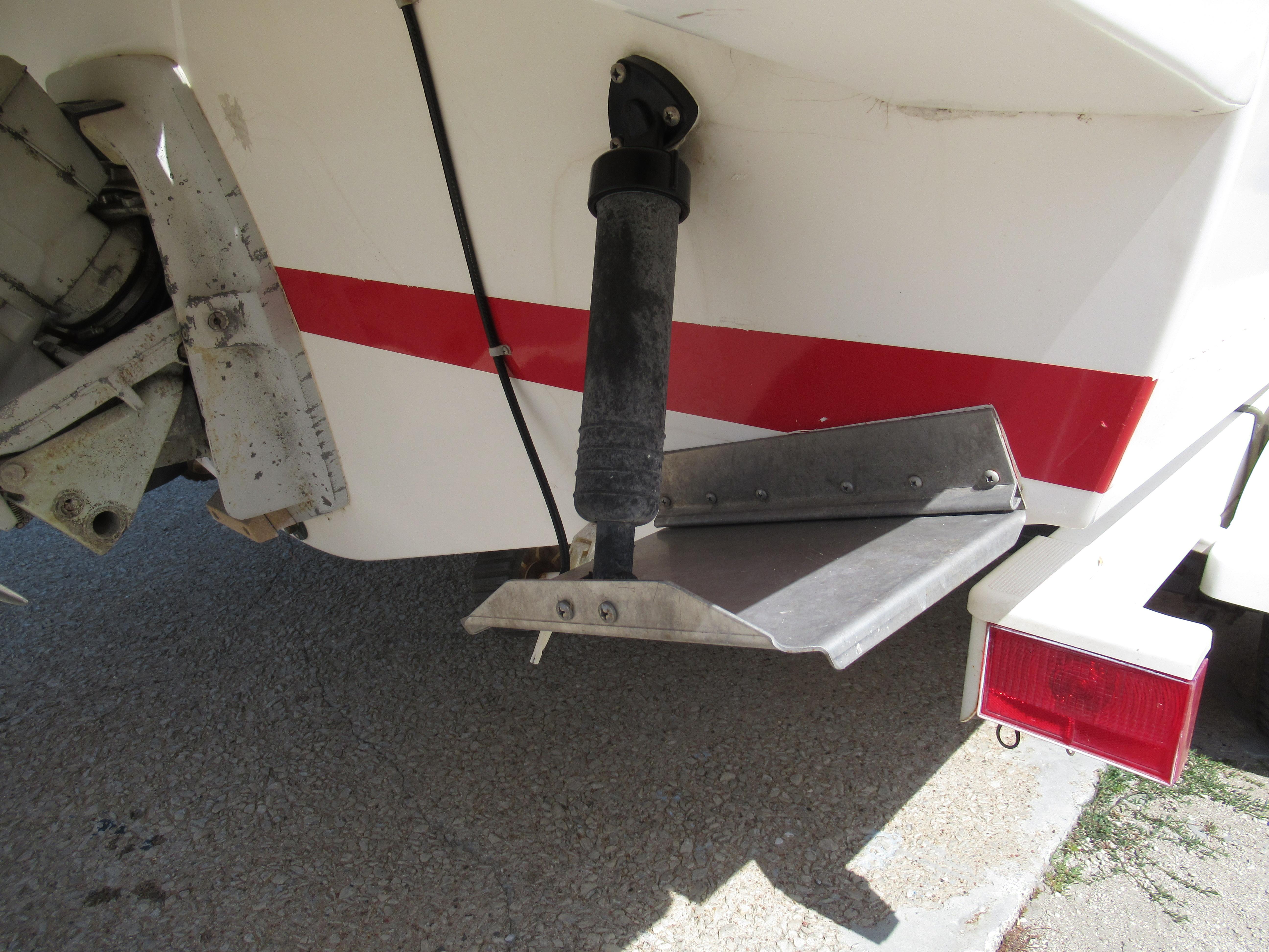 Slide: The Image of Close-up of the stern and trim tab of a 1990 Wellcraft 23 NOVA boat. - 17