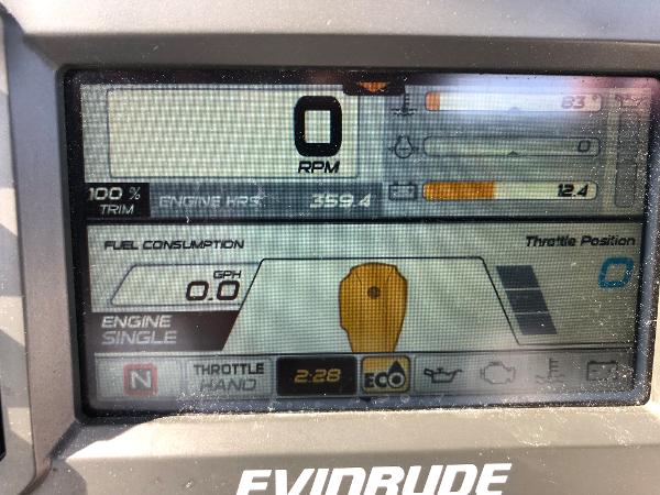 Slide: The Image of Dashboard display of a 2019 Wellcraft 242 Fisherman boat showing engine metrics and controls. - 19