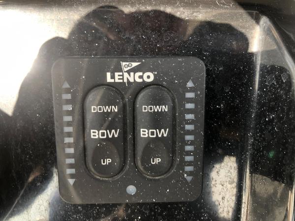 Slide: The Image of Lenco trim tab control panel on 2019 Wellcraft 242 Fisherman boat dashboard. - 21