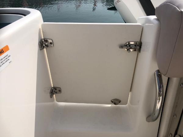 Slide: The Image of 2019 Wellcraft 242 Fisherman boat door with stainless steel hinges and handle. - 25