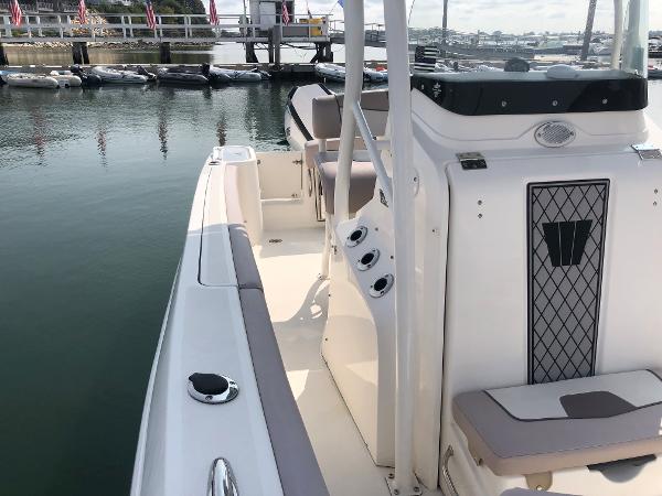 Slide: The Image of 2019 Wellcraft 242 Fisherman boat docked, featuring sleek design and spacious deck layout. - 38