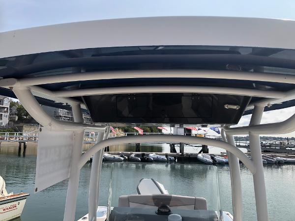 Slide: The Image of 2019 Wellcraft 242 Fisherman boat with T-top, docked at marina. - 40