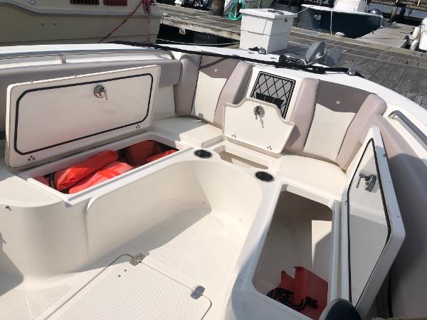 Slide: The Image of 2019 Wellcraft 242 Fisherman boat interior with open storage compartments. - 47