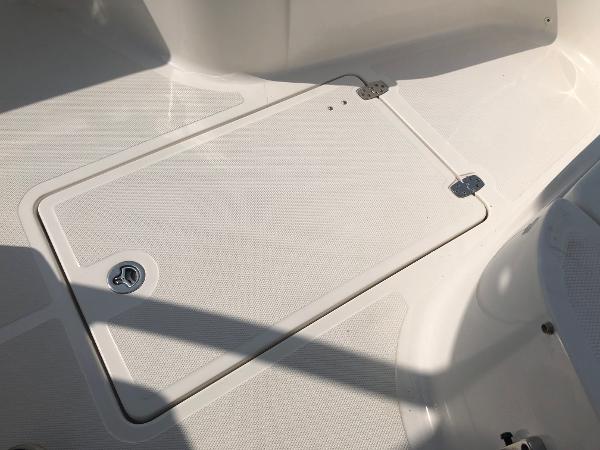 Slide: The Image of 2019 Wellcraft 242 Fisherman boat deck with storage compartment. - 48