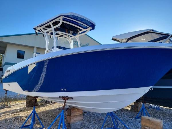 Slide: The Image of 2023 Wellcraft 242 Fisherman boat in vibrant blue on display. - 0