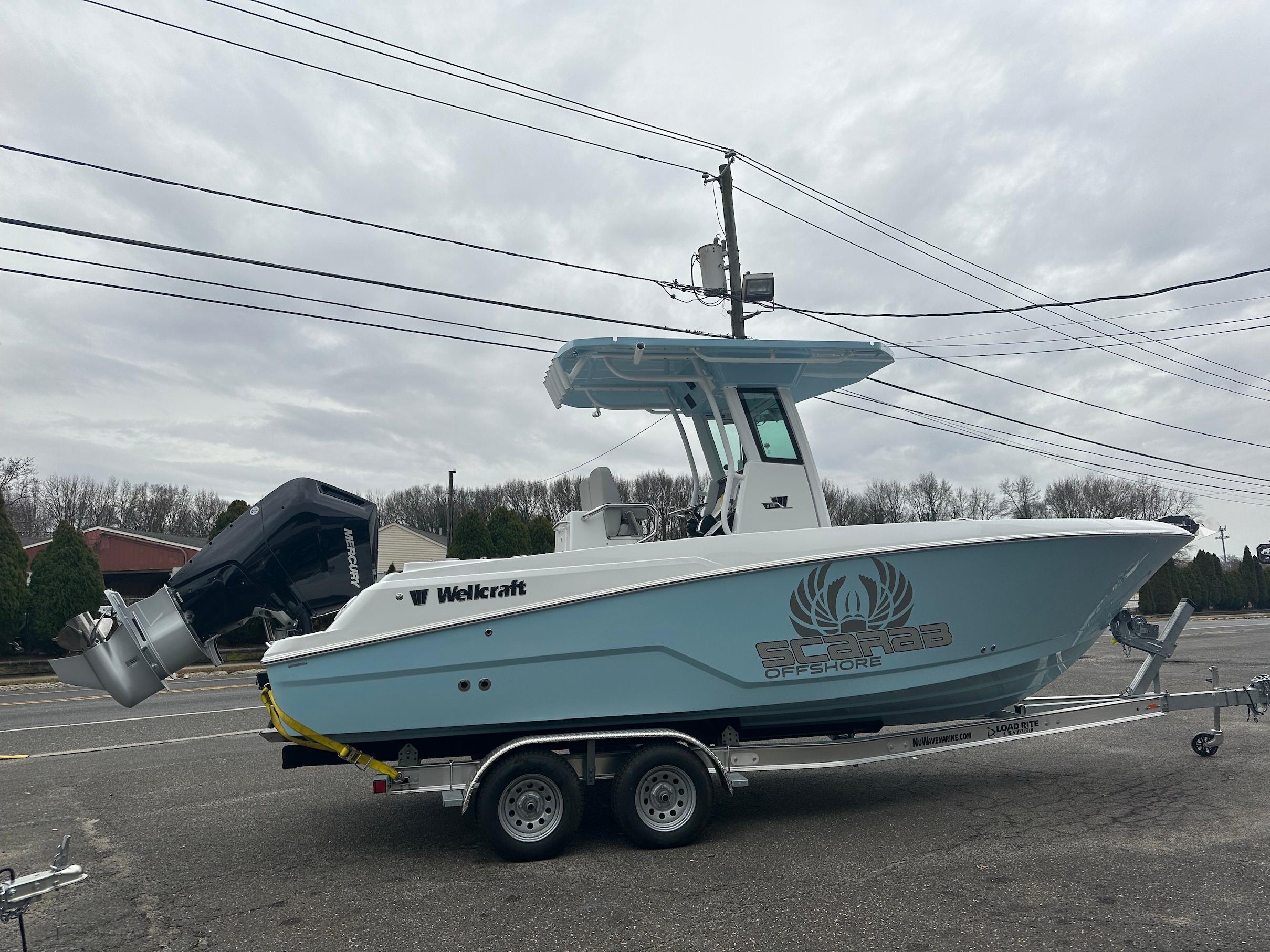 Slide: The Image of 2024 Wellcraft 243 Fisherman boat on trailer, side view, outdoors. - 0