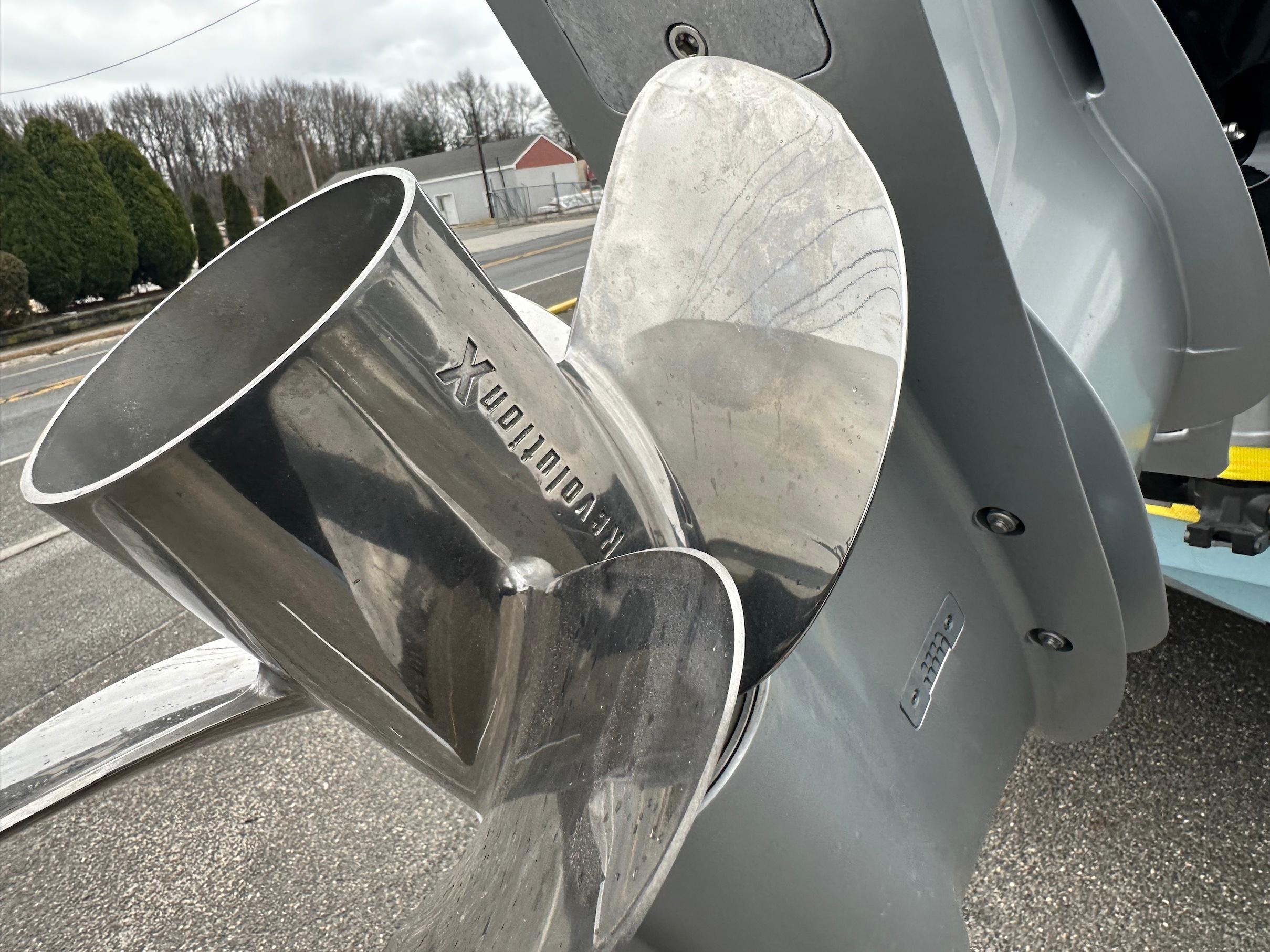 Slide: The Image of Close-up of a 2024 Wellcraft 243 Fisherman boat's stainless steel propeller. - 1