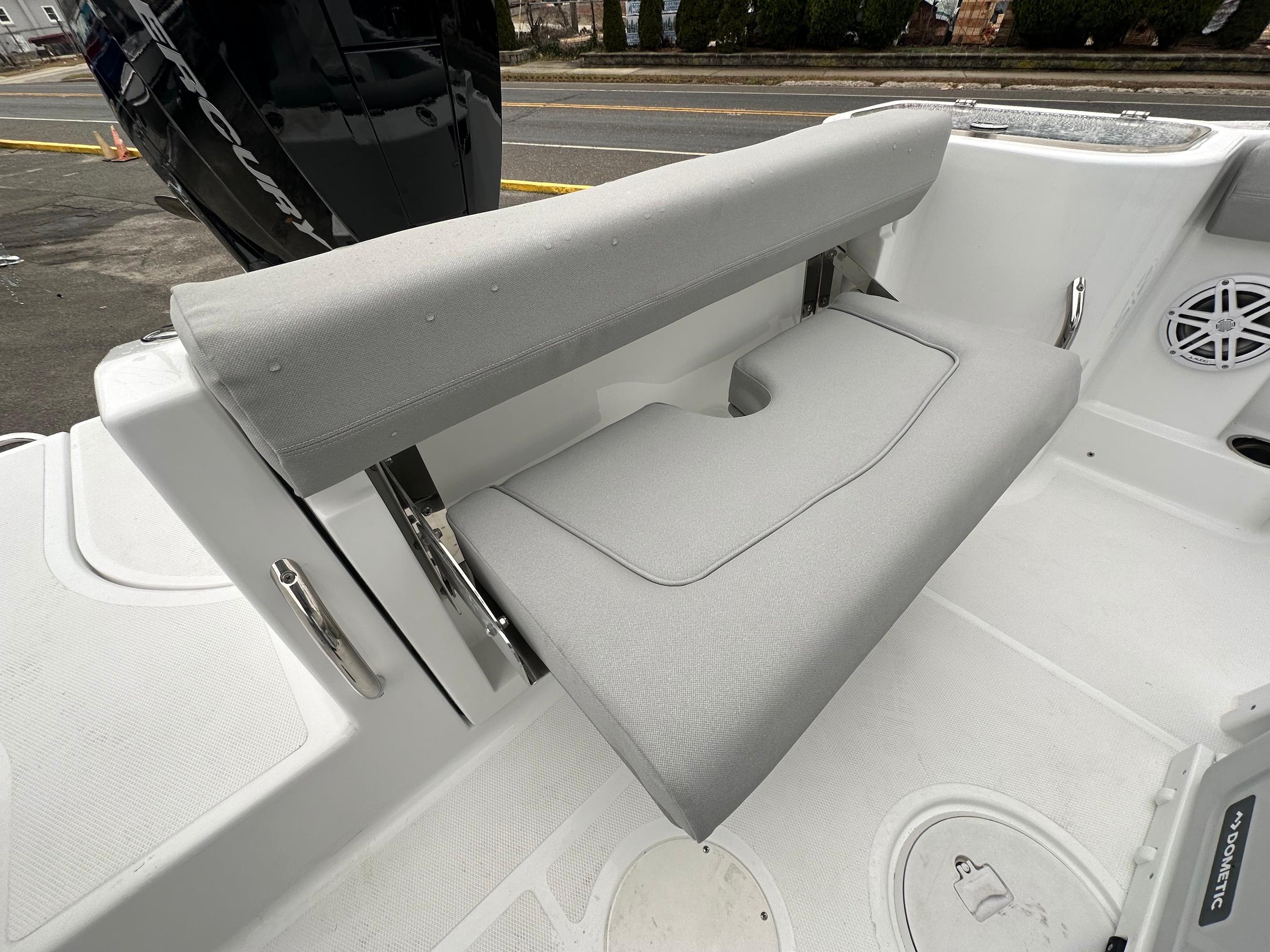 Slide: The Image of 2024 Wellcraft 243 Fisherman boat with foldable rear seat and Mercury outboard engine. - 12