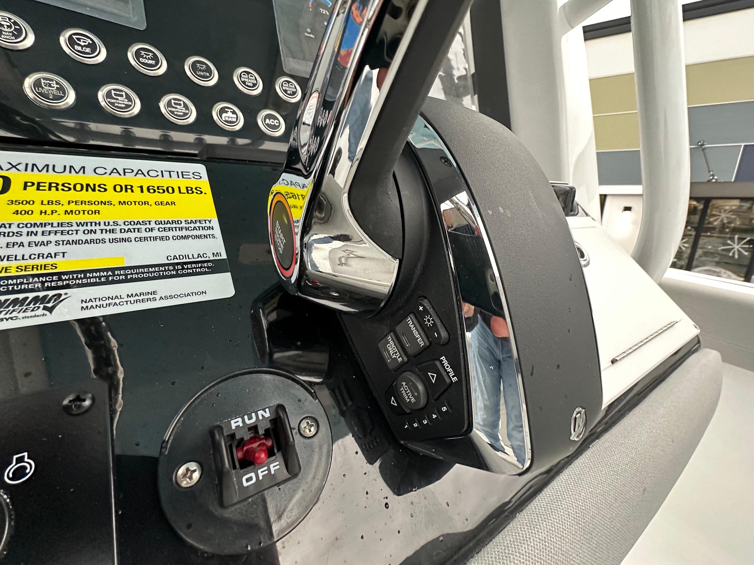 Slide: The Image of Close-up of the control panel on a 2024 Wellcraft 243 Fisherman boat. - 16