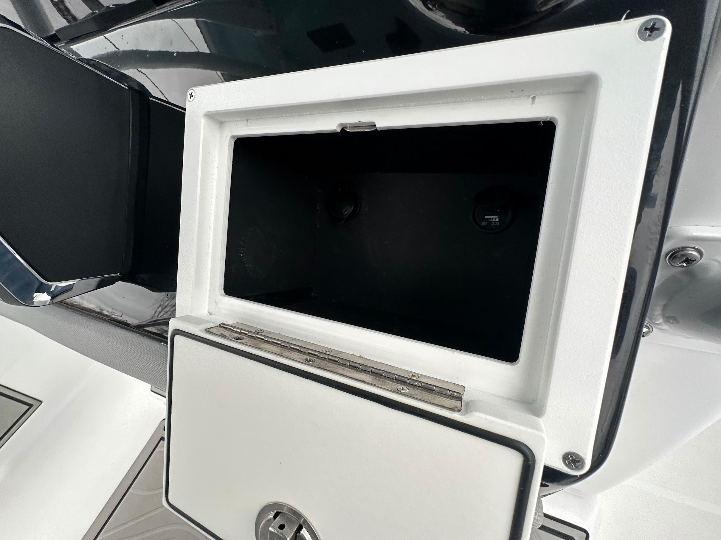 Slide: The Image of Open storage compartment on a 2024 Wellcraft 243 Fisherman boat. - 18