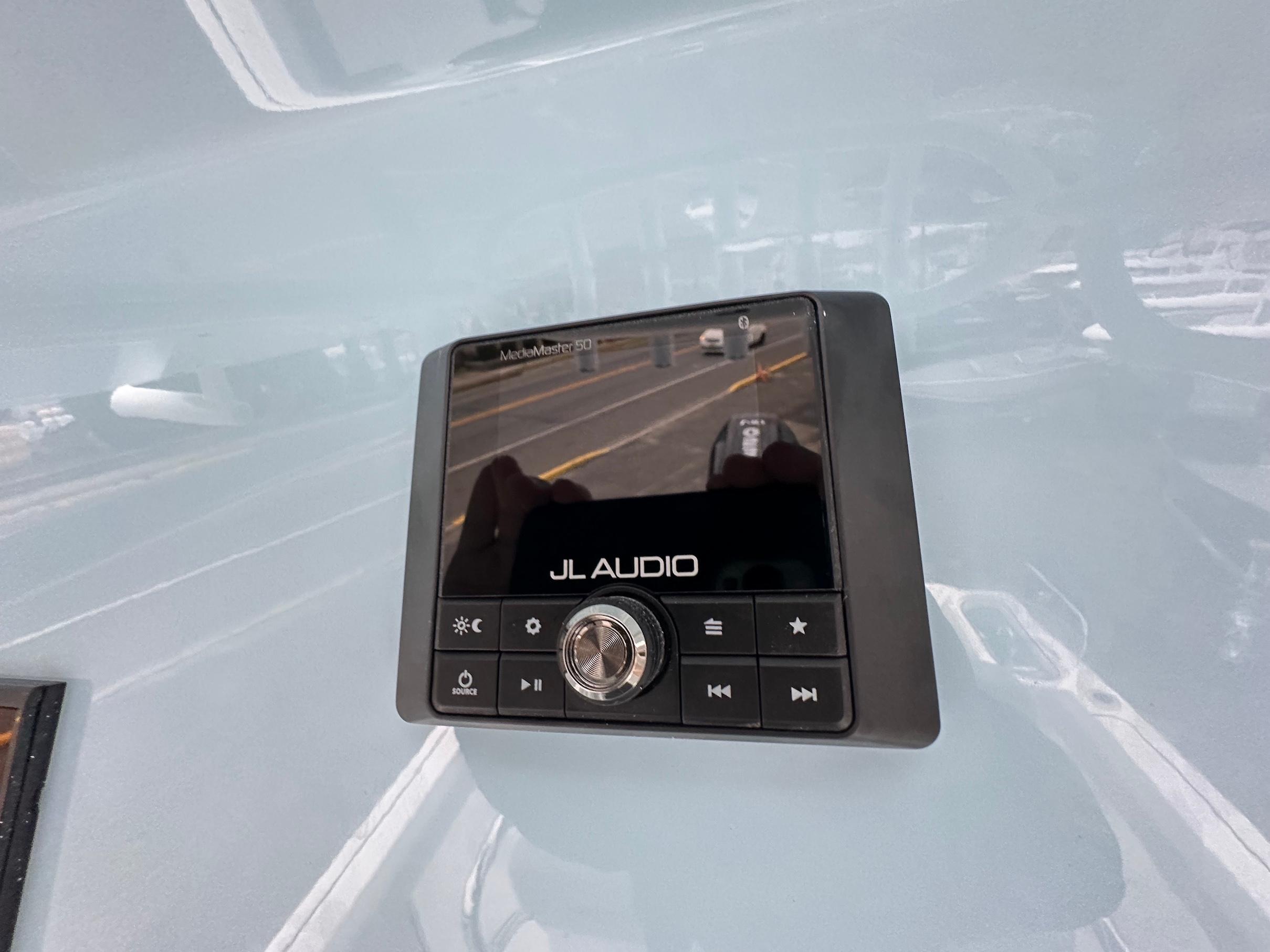 Slide: The Image of JL Audio MediaMaster 50 control panel on 2024 Wellcraft 243 Fisherman boat. - 20