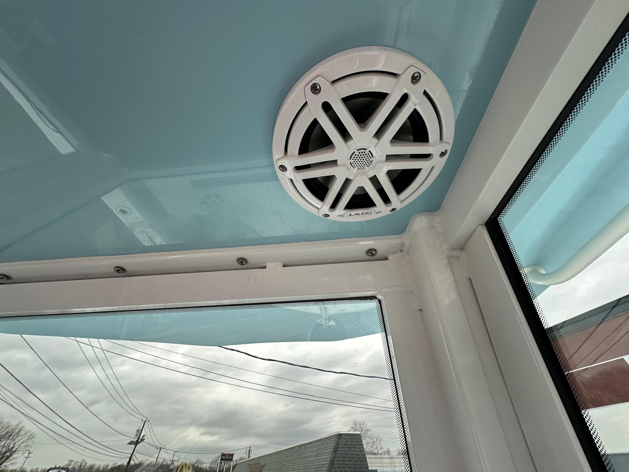 Slide: The Image of 2024 Wellcraft 243 Fisherman boat interior with JL Audio speaker. - 21