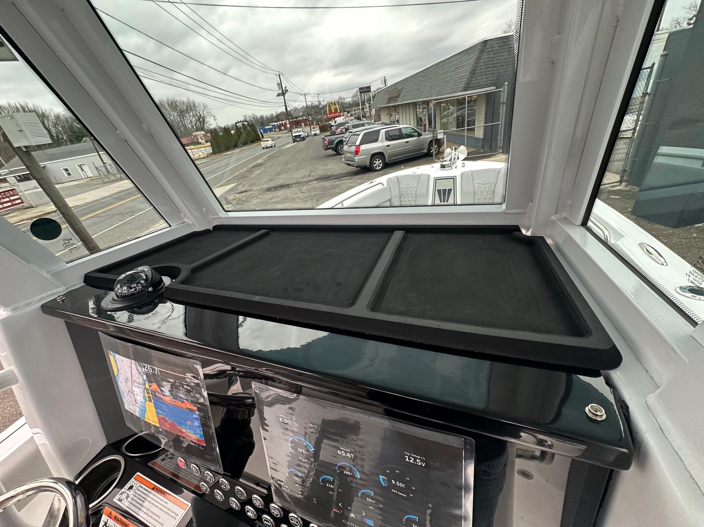 Slide: The Image of 2024 Wellcraft 243 Fisherman dashboard with navigation system and compass. - 22