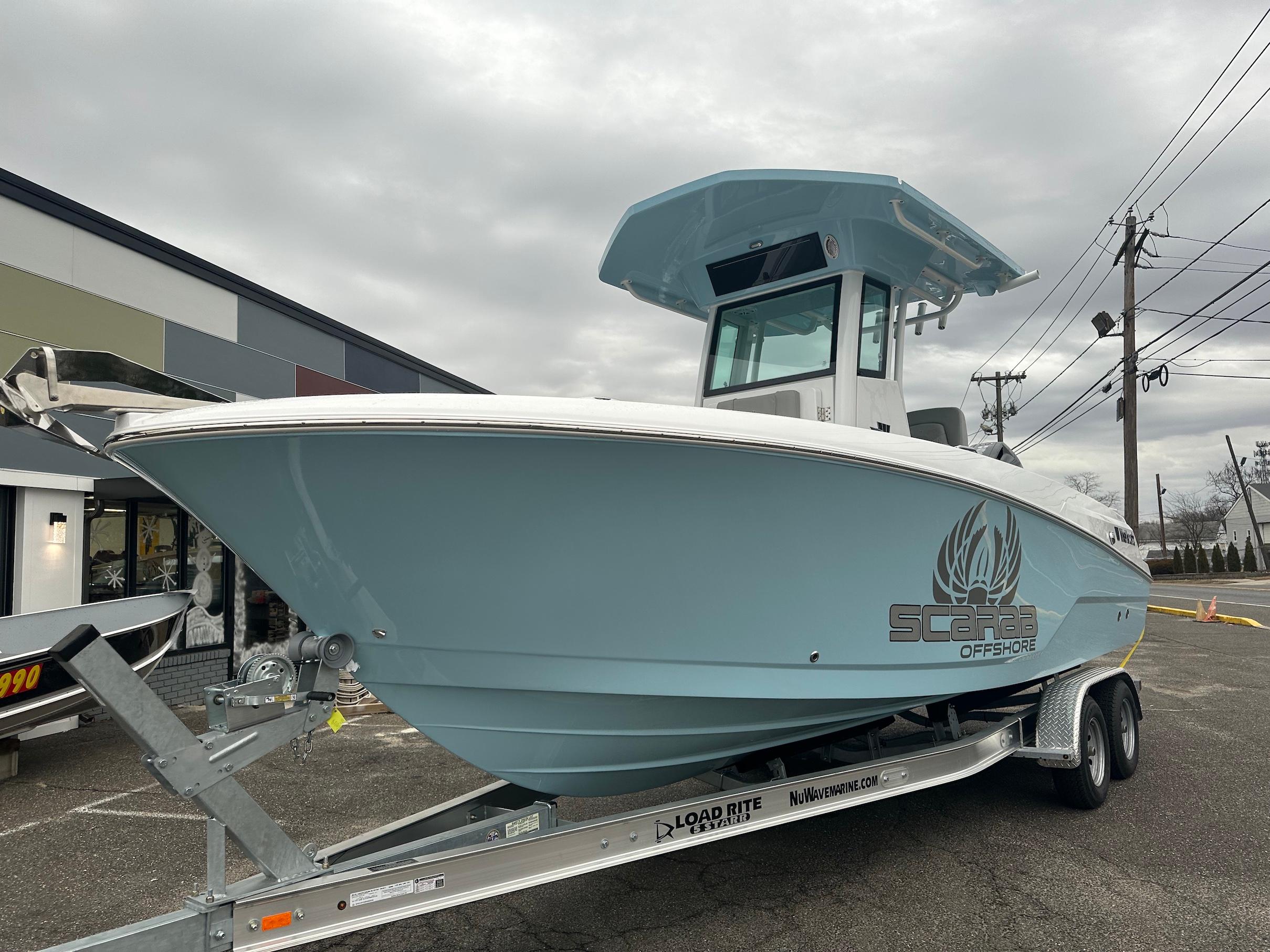 Slide: The Image of 2024 Wellcraft 243 Fisherman boat on trailer, Scarab Offshore model. - 5
