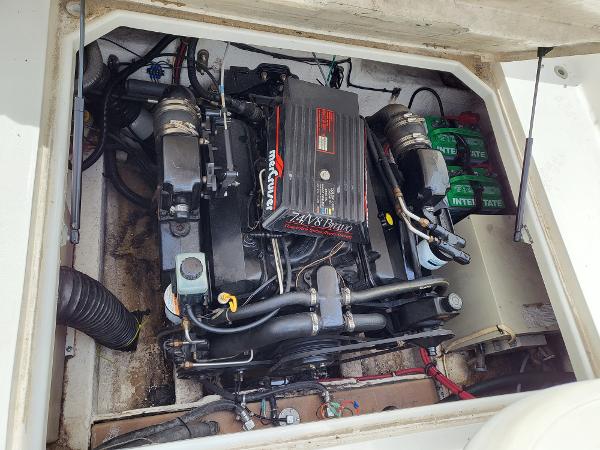 Slide: The Image of 1995 Wellcraft 26 Exel SE engine compartment with MerCruiser 7.4L Bravo engine. - 1