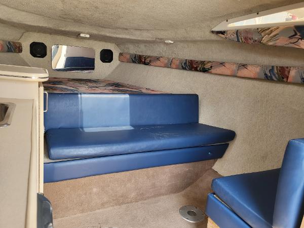 Slide: The Image of Interior cabin of a 1995 Wellcraft 26 Exel SE boat with blue seating. - 5