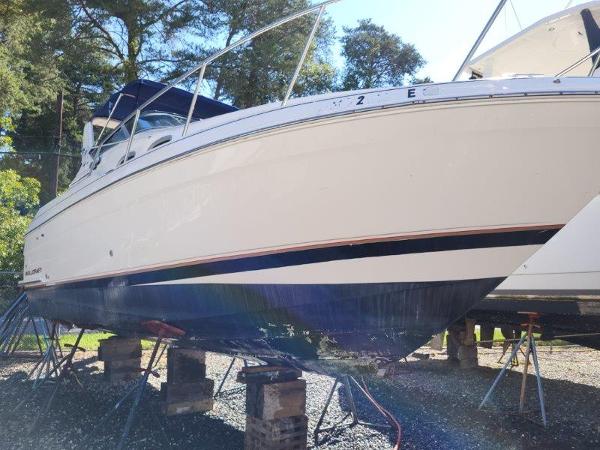 Slide: The Image of 1997 Wellcraft 2800 Martinique boat on stands for maintenance. - 0